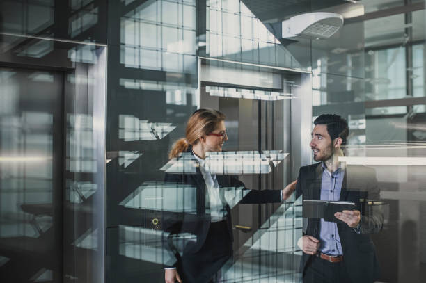 istock Business People Discussing in The Lobby 1135693248