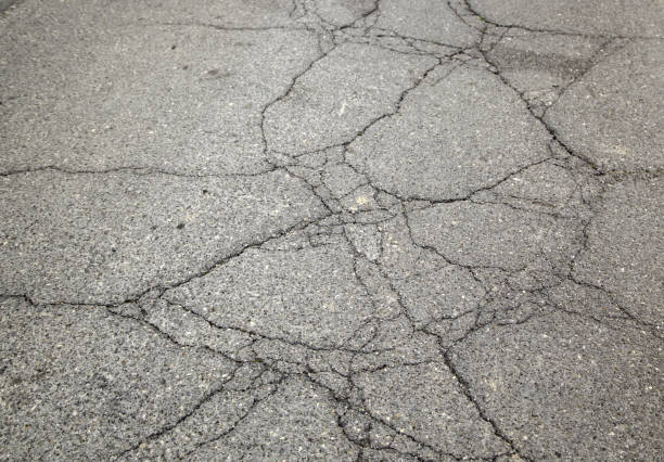 istock Cracked road detail 1135695066