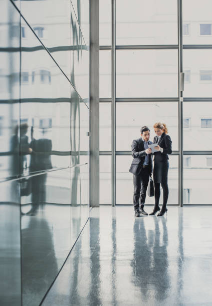 istock Business People Discussing in The Lobby 1135695651