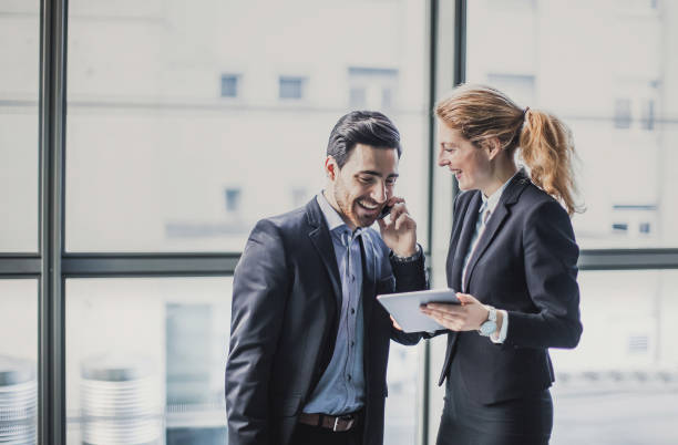 istock Business People Discussing in The Lobby 1135695663