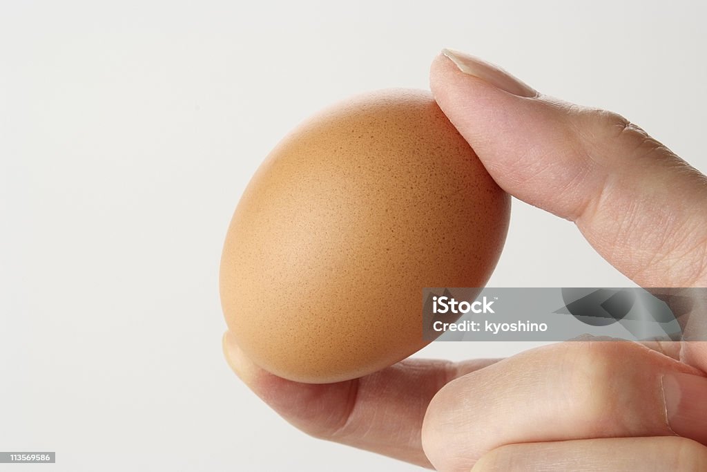 絶縁ショットの指を卵で、白背景 - カットアウトのロイヤリティフリーストックフォト