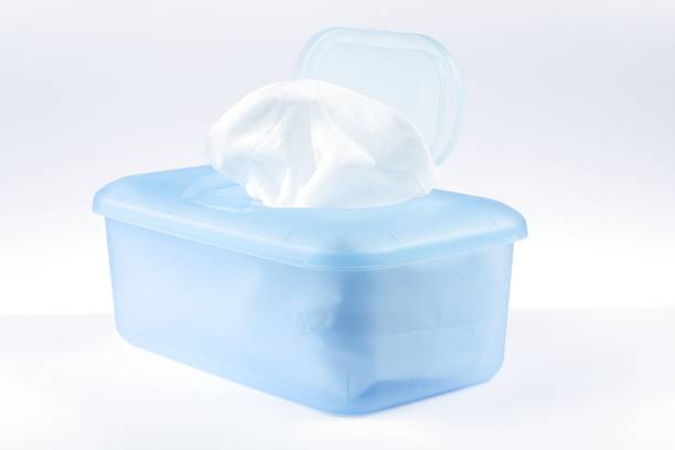 Blue plastic container filled with wet wipes stock photo