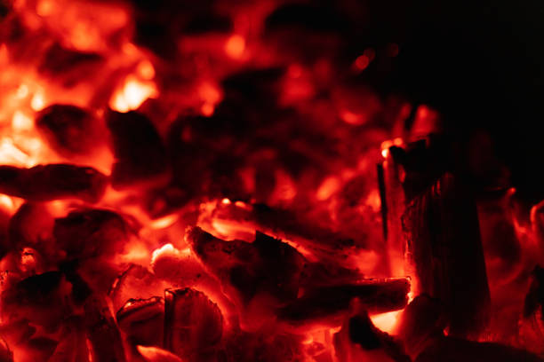 istock background glowing hot coals closeup. texture of burning coals 1135697663