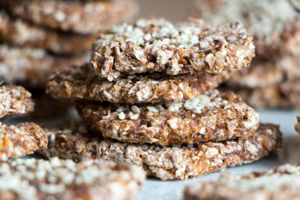 istock Vegan cookies from wheat and raisins stacked on plate. Front view. 1135697786