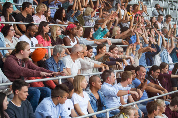 Mexican wave on stadium People doing the mexican wave on the sport or music event. doing the wave stock pictures, royalty-free photos & images