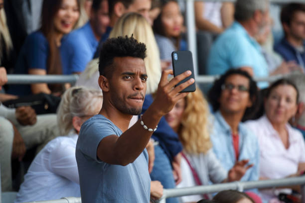 istock Man taking a selfie at a footbal match 1135698990