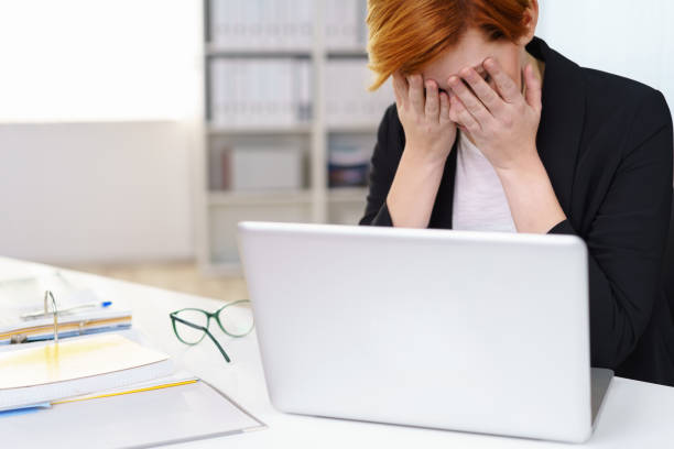 istock Despairing stressed businesswoman 1135699018