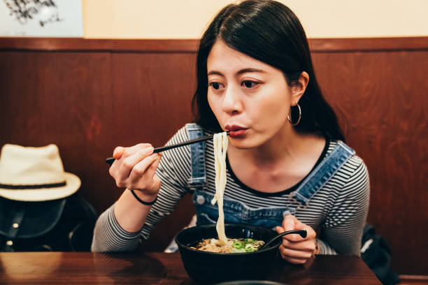 istock japanese lady having lunch in local restaurant 1135699061