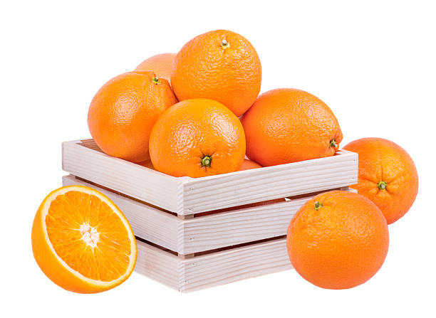 istock Oranges in a wooden box isolated on white background with clipping path 1135699247