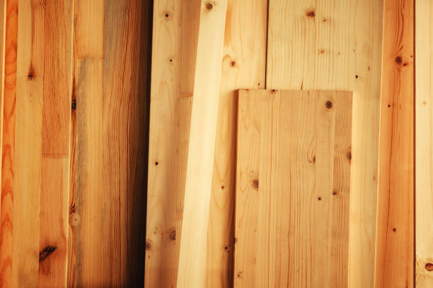 Pine wood floorboard planks in workshop ready to be used for hardwood flooring