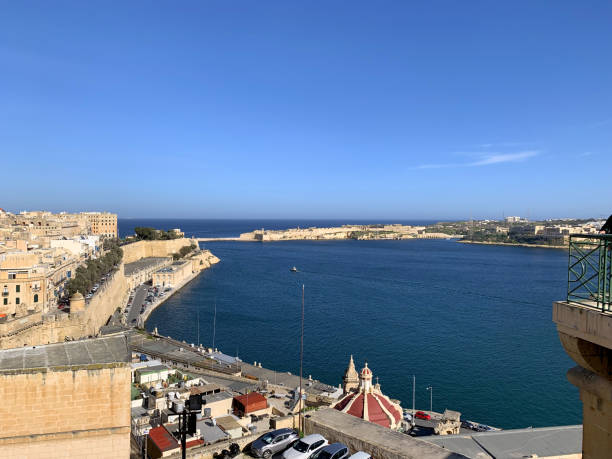 istock Road near coast line with buildings 1135702008