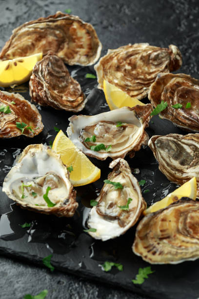 istock Fresh Oysters platter with lemon and ice 1135702796