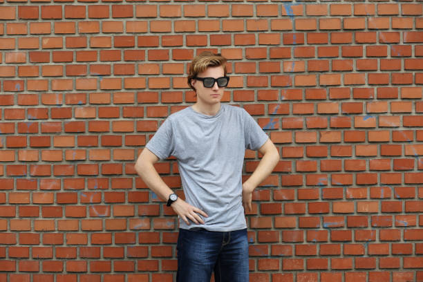 istock Teenager standing near a brick wall 1135704507