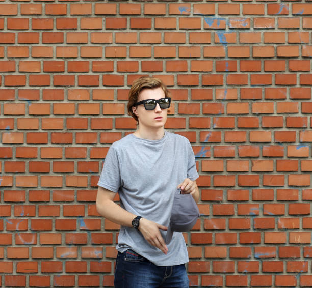 istock Teenager standing near a brick wall 1135704517