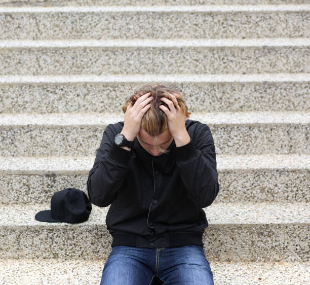 istock Teenager depressed sitting 1135704564