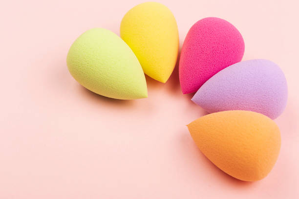 istock Colorful beauty sponges on pink background 1135709706