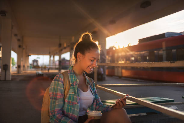 istock Surfing the net on train station 1135710555