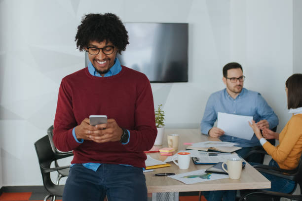 istock African American businessman using mobile phone during coffee break 1135710795