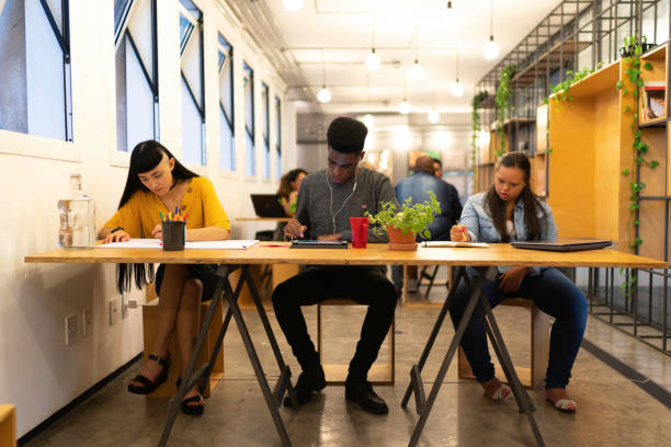 istock Business people working on a modern coworking space 1135710872