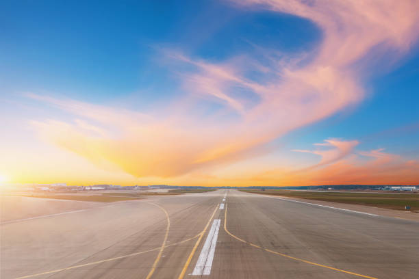 istock Empty runway at evening airport during sunset 1135711088