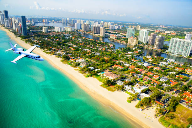 istock Airplane flying over Miami Beach, Florida, USA. 1135711191