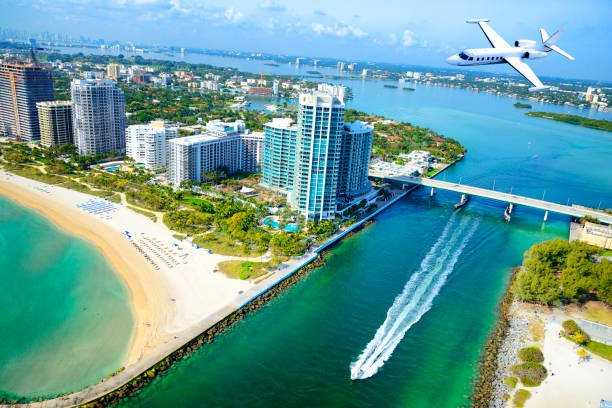 istock Airplane flying over Miami Beach, Florida, USA. 1135711194