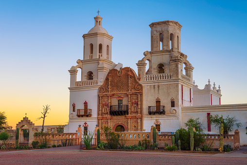 Sunrise at the San Xavier Mission Church in Tucson, Arizona. This historic spanish catholic mission was founded in 1692 and is located on the Tohono O'odham Nation indian reservation.