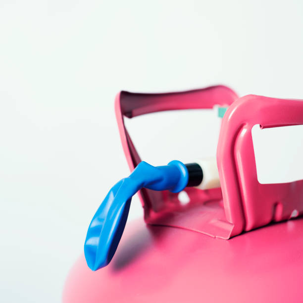 istock inflating a balloon with helium from a cylinder 1135712424