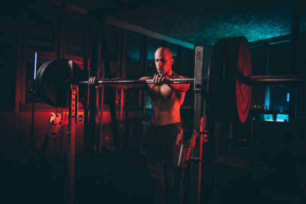 istock Shirtless man preparing for weightlifting training 1135712428