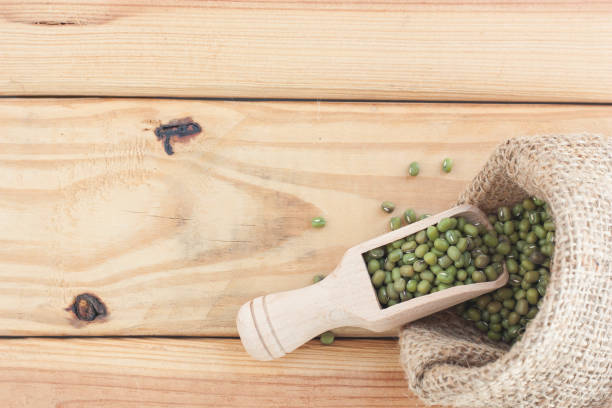 istock Whole grains in wood scoop on wooden table. 1135712689