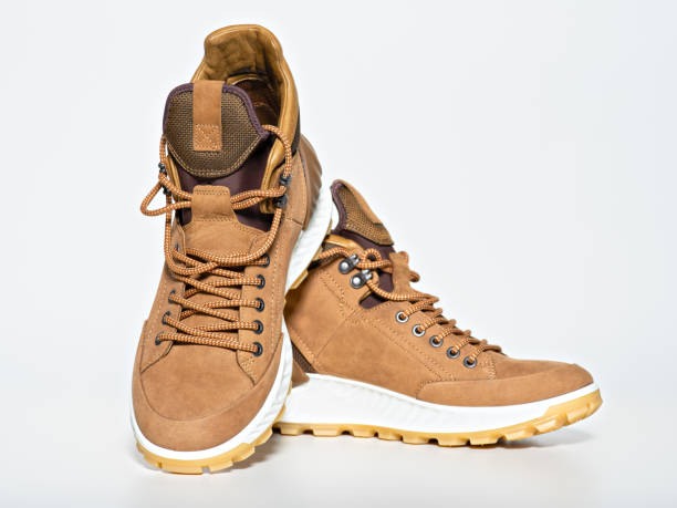 istock Pair of new hiking boots isolated on white 1135713341