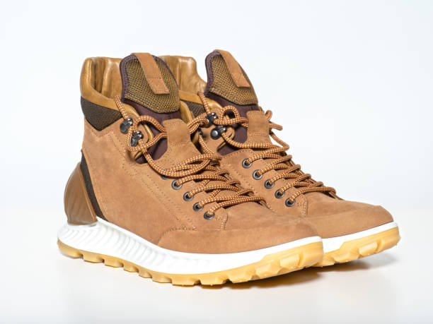 istock Pair of new hiking boots isolated on white 1135713343