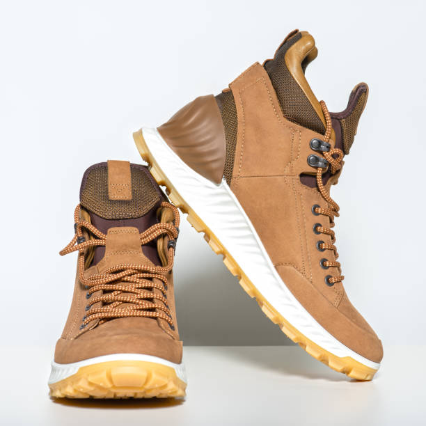 istock Pair of new hiking boots isolated on white 1135713349