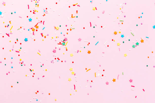 istock Pink confetti and stars and sparkles on pink easter background. 1135713408