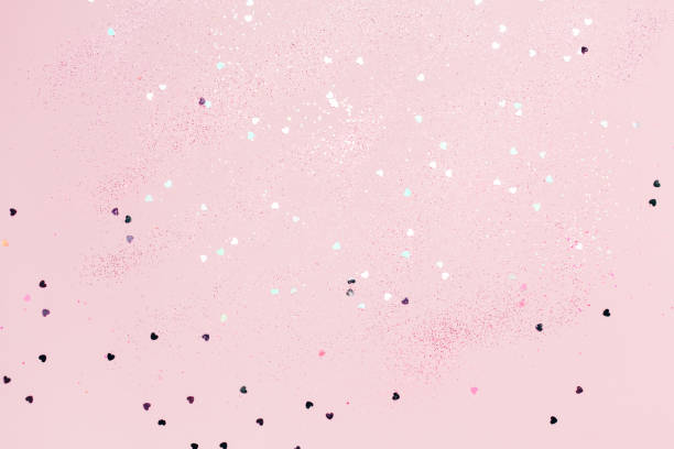 istock Pink confetti and stars and sparkles on pink background. 1135713421