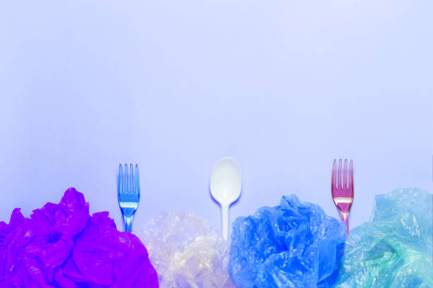 Plastic cutlery and plastic bag in plate. setout with plastic garbage.