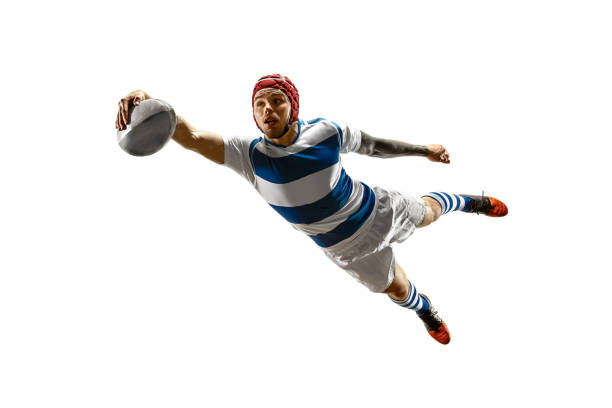 The silhouette of one caucasian rugby male player isolated on white background The silhouette of one caucasian rugby male player isolated on white background. Studio shot of fit man in motion or movement with ball. Jump and action concept. An incredible strain of all forces rugby stock pictures, royalty-free photos & images