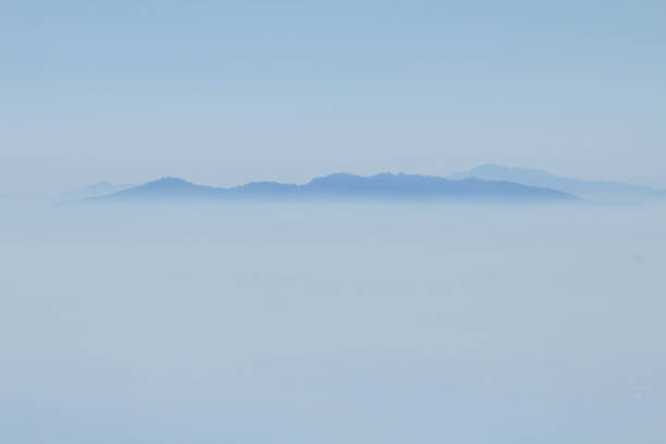 istock Top of mountain view with mist on morning 1135714094