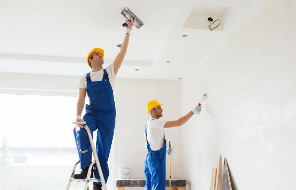 istock group of builders with tools indoors 1135716245