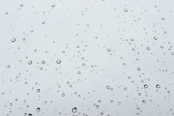 istock Water drops on clean bright window focused detail 1135716762