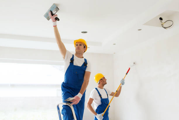 istock group of builders with tools indoors 1135716923