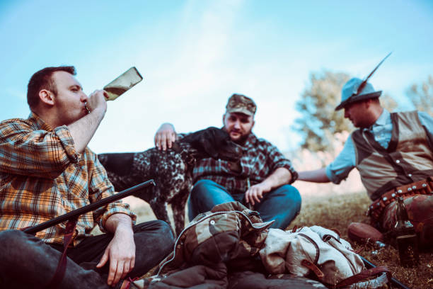 istock Hunters Having A Drinking Party After A Successful Day 1135722405