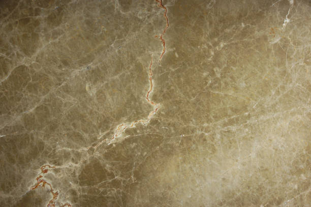 istock Natural marble light brown with cracks and streaks is called Emperador Light 1135723728
