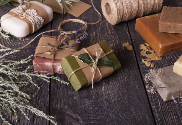 istock A variety of fragrant handmade soap and packaging on dark boards 1135724812
