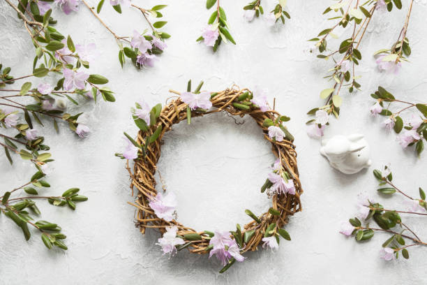 istock Spring wreath with flowers. Creative flat lay. View from above. 1135725967