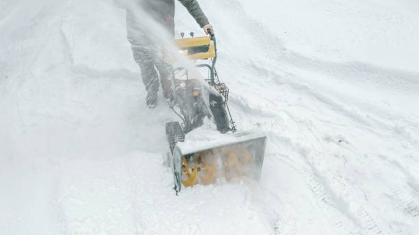 istock The small snow plower throwing out the ice on the side 1135727657