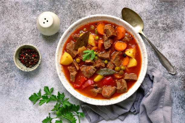 istock Meat stew with vegetables in tomato sauce 1135727680