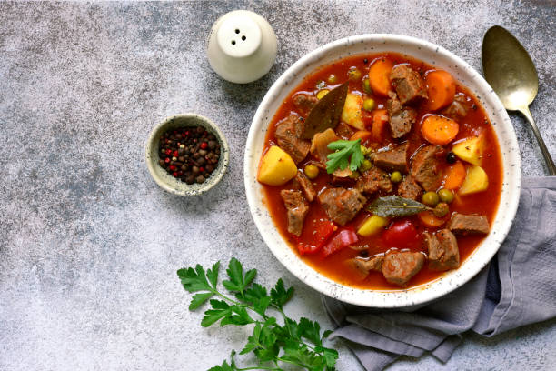 istock Meat stew with vegetables in tomato sauce 1135727825