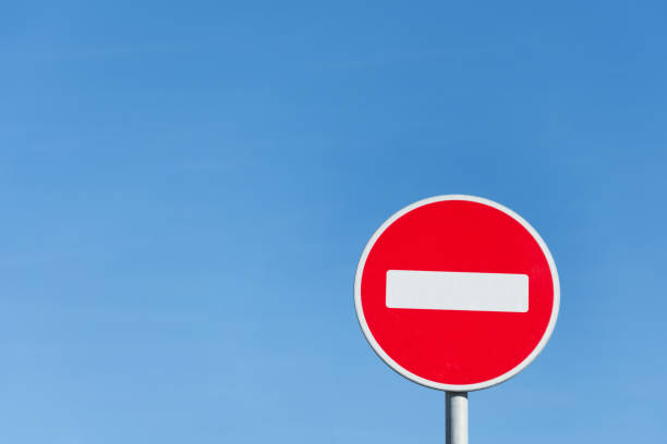 istock Round stop sign against a blue sky. 1135729971