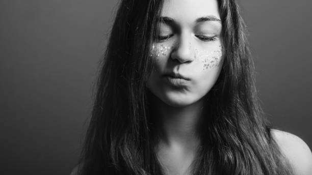istock young woman think uncertainty black white headshot 1135730185